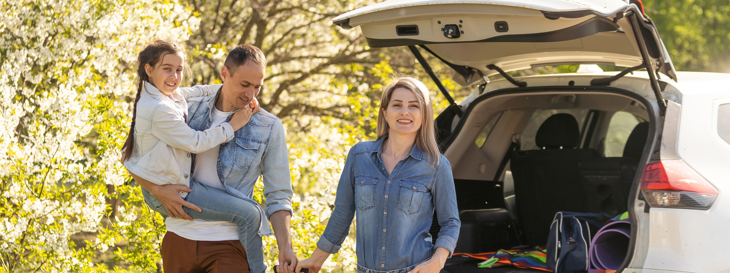 Family loading a three-row SUV near Orange Beach, Alabama
