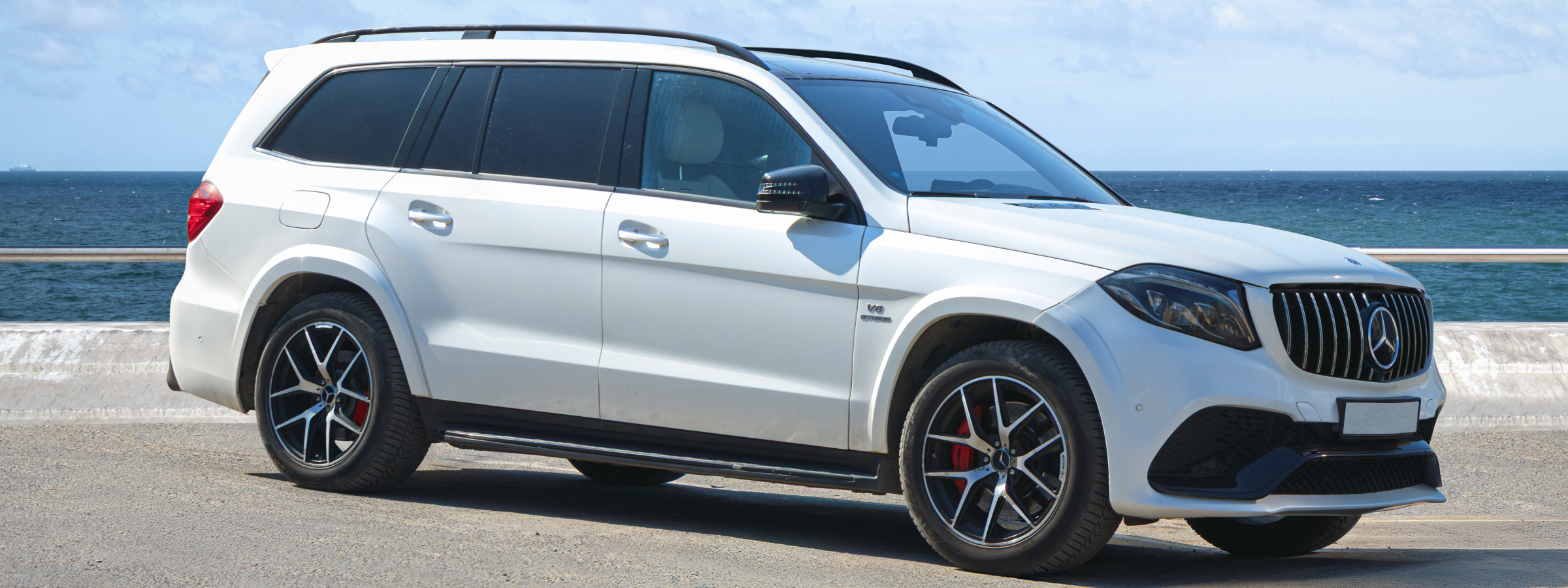 Luxury Mercedes-Benz SUV on the beach along the Alabama Gulf Coast