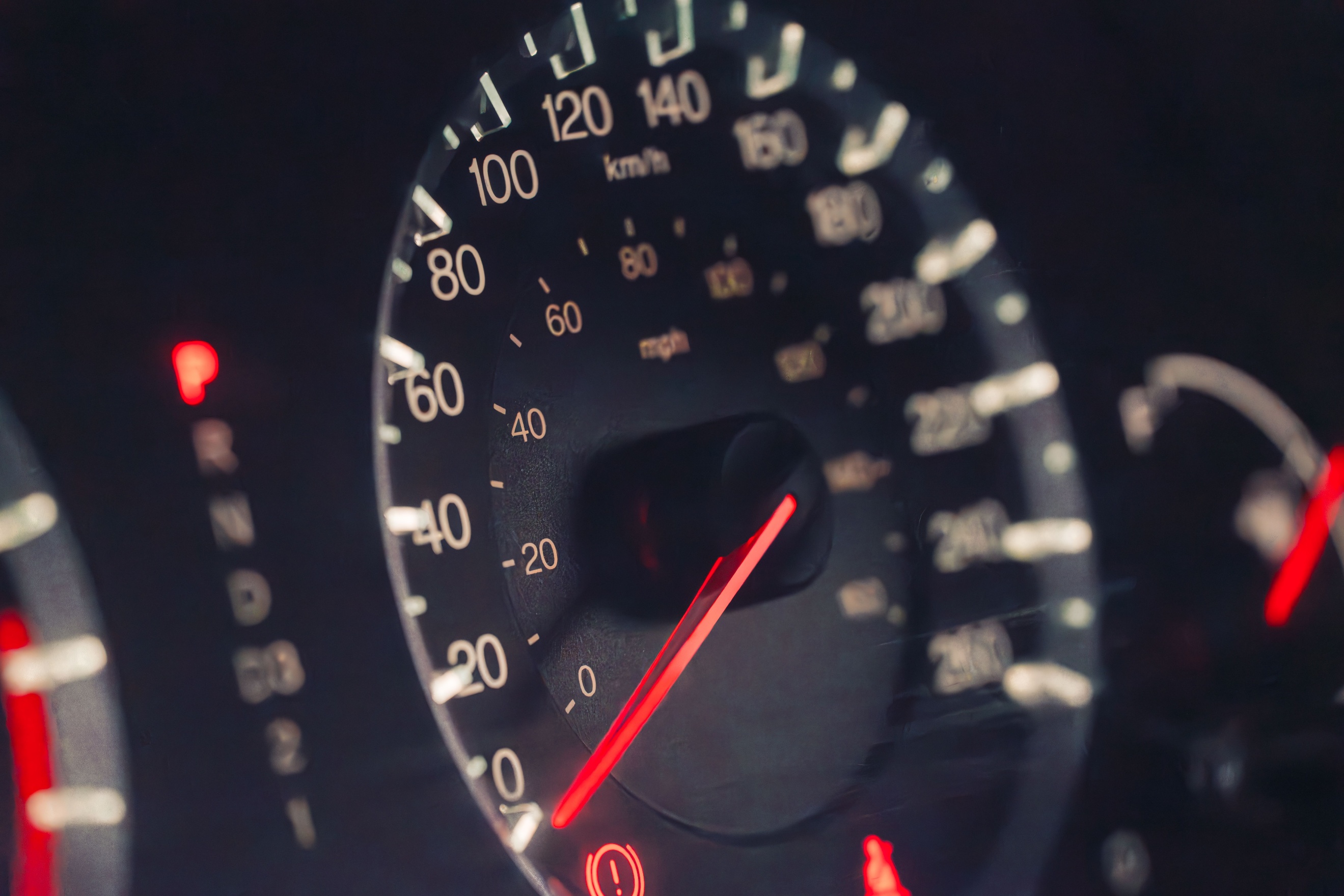 Vehicle mileage and dashboard representing trade-in value factors for Illinois and Wisconsin drivers