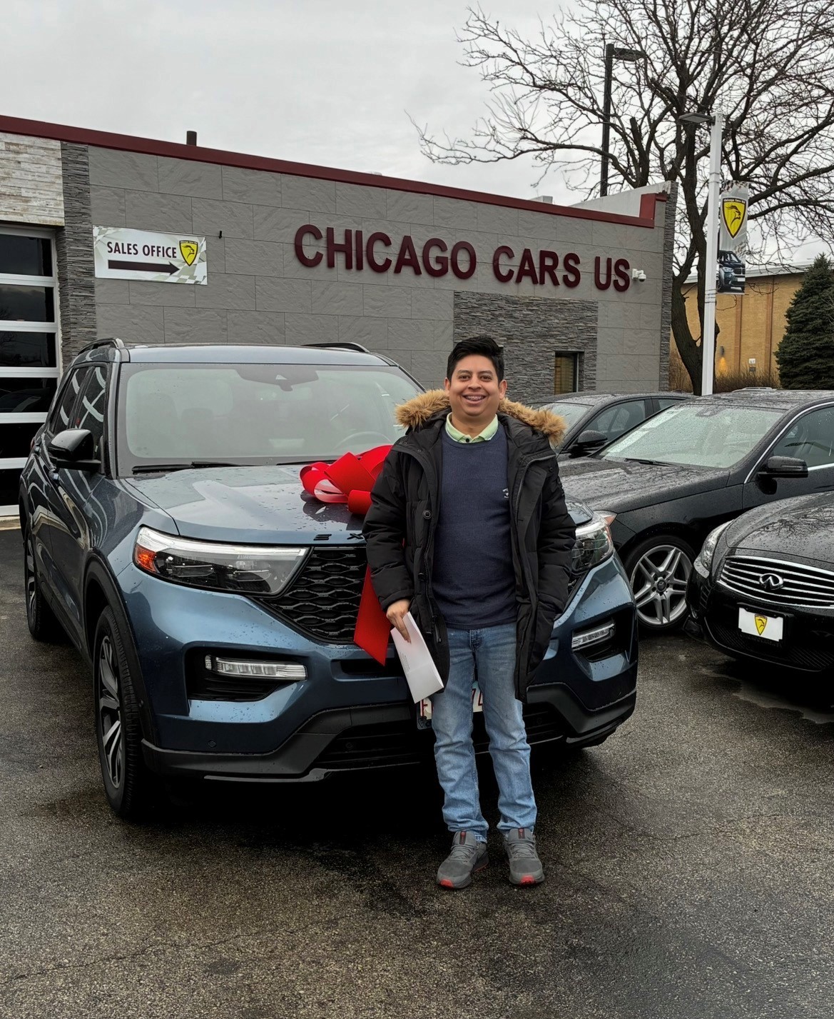 Customer with their 2020 Ford Explorer ST at Chicago Cars US
