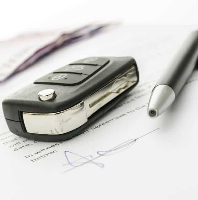Car key on signed contract